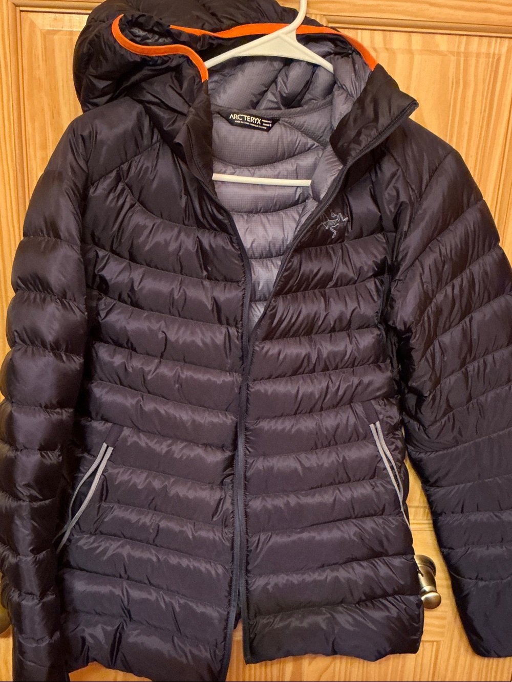 Arc'teryx Women's Hooded Down Puffer Jacket in Dark Navy with Orange Trim